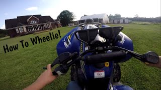 How to Wheelie a Automatic Four Wheeler [upl. by Anear]