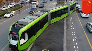 Smart train Worlds first trackless smart train begins test run in China  TomoNews [upl. by Nek]