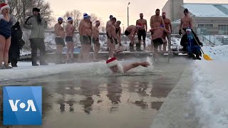 Russian Swimming Club Celebrates Christmas in Freezing Waters [upl. by Silverts]