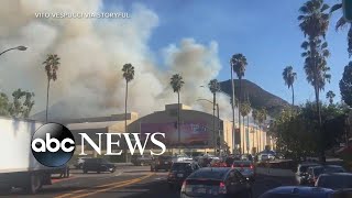 Wildfires in California spread dangerously close to Hollywood  ABC News [upl. by Esinert]