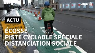 Coronavirus Glasgow crée une piste cyclable pour faciliter la distanciation sociale  AFP [upl. by Zulema]