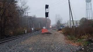 103024 Amtraks downeaster approaches Main Street in Plaistow NH heading to Maine Past CSX [upl. by Eimac774]