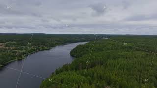 Camera gliding over a serene fjord and lush forest in the Aland islands archipelago showcasing the [upl. by Mac]