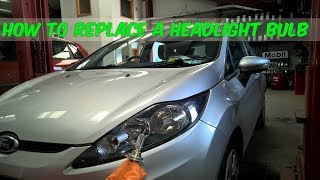 How To Replace A Headlight Bulb In A Ford Fiesta [upl. by Madancy]