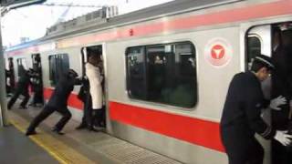 People stuffed onto a train in Tokyo Japan train stuffing Tokyo [upl. by Binny]