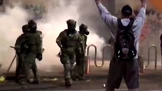 WARNING GRAPHIC CONTENT  US riot police use tear gas hit Portland protester with batons [upl. by Cohbert]