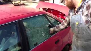 Breaking a car window with a center punch [upl. by Ahsinrev]