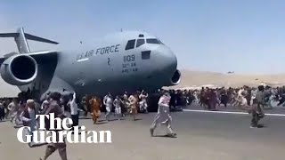 Afghans climb on to plane during takeoff in attempt to flee Taliban [upl. by Autum]