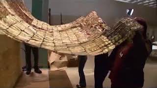 El Anatsui installing quotBetween Earth and Heavenquot [upl. by Nnylimaj]