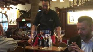 Zeughauskeller waiter mixing a flaming beer drink [upl. by Aihsakal]