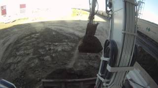 Takeuchi TB180 top of cab view loading a tandem truck [upl. by Gretta]