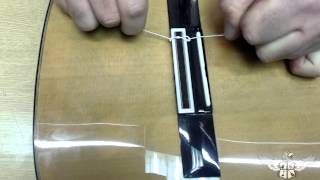 How to restring a nylon string classical guitar [upl. by Magnum]