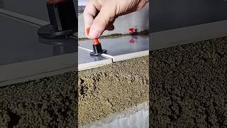 Device for leveling ceramic tiles during installation in action [upl. by Ashlee]