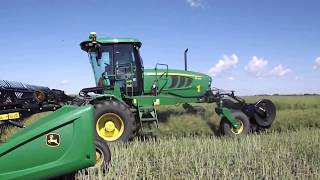 John Deere W150 swather in Saskatchewan [upl. by Aihsiyt789]