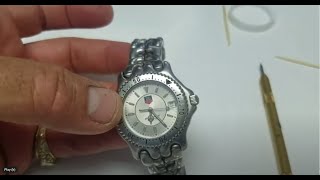 How to change the battery on a TAG Heuer Link Watch [upl. by Arramat]