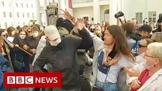 Belarus protests Women try to unmask those detaining protesters  BBC News [upl. by Bartholemy]