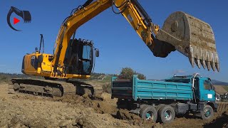 JCB JS130LC excavator loading TATRA trucks [upl. by Neehahs]