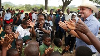 Celebration in Zimbabwe as a white farmer returns to seized land [upl. by Lada221]