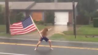 Florida crazy man challenges hurricane Matthew with American flag in hand [upl. by Poll]