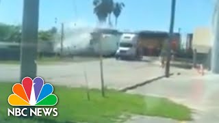 Watch SemiTruck Split In Half By Incoming Train  NBC News [upl. by Arted]