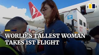 World’s tallest woman rides on a plane for the first time [upl. by Gunthar49]