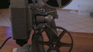 Loading and Rewinding an 8mm Projector Revere 85 [upl. by Nnyliak]