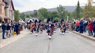 Massed Pipes and Drums marching through Braemar to the 2022 Braemar Gathering in Scotland [upl. by Borer371]