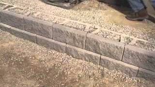 DIY Superstore  Installing a Retaining Wall [upl. by Aieki884]