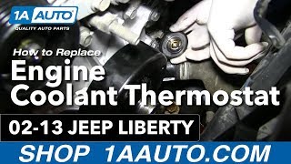 How To Replace Thermostat Housing 0213 Jeep Liberty [upl. by Nuahc]