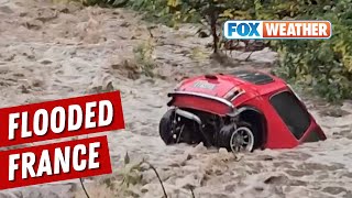 Raging Floods Send Mini Cooper Tumbling Downstream In France [upl. by Derrik]