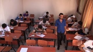 Syrian students sit exams in Damascus [upl. by Nosnej]