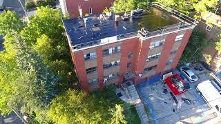 Installing the Soprema Sopralene 180 Base Sheet on this Apartment Building Roof Project [upl. by Anemix170]