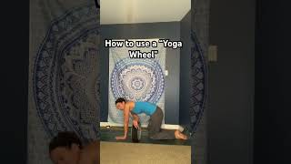 How to use a Yoga Wheel  Thread the needle [upl. by Weisler492]