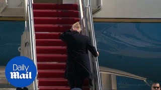 Trumps hair goes wild in wind as he boards Air Force One to WV [upl. by Adanama]