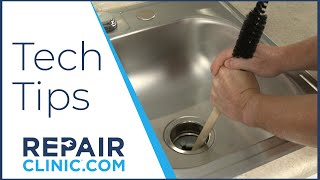 Use A Wood Handle to Unjam Garbage Disposal  Tech Tips from Repair Clinic [upl. by Notnad959]