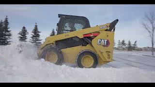 Using a Cat® 262 Skid Steer for Snow Removal [upl. by Eenalem786]