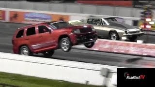 Fastest NA SRT 8 Jeep Cherokee vs Big Block Camaro  Wheelstand  Drag Race Video  Road Test TV® [upl. by Ellebasi]