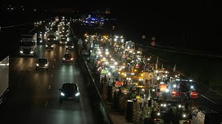 France  protesting farmers block a highway with tractors near wholesale food market  AFP [upl. by Macy844]