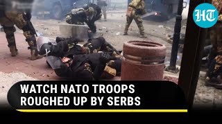 USled NATO troops chased beaten with sticks by Serbs in Kosovo  Dramatic Footage Goes Viral [upl. by Aiyram]