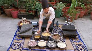 Traditional Mexican Culinary technique to make Corn Masa after Nixtamalization grinded on a Metate [upl. by Ibmat]