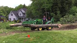 John Deere 2038R with 55quot Wicked Root Grapple Tackling Big Log [upl. by Iona707]