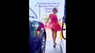 Windy day pumping gas with orange polka dot dress [upl. by Jemma]