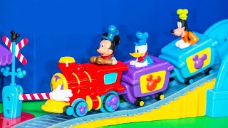 Family playing the Mickey Mouse Train and Track Playset [upl. by Yralih886]