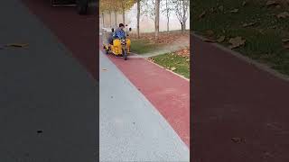 The process of clearing fallen leaves on sidewalks with high pressure water guns [upl. by Alik]