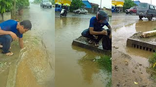 Unclogging Culverts Drain Flood Rain On Street Road While Raining [upl. by Celinka]