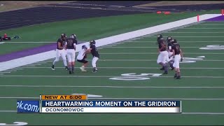 Opposing player lets Wisconsin boy with Down syndrome make his first tackle in football game [upl. by Marbut]