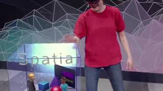 Microsofts Julia Schwarz playfully interacts with Mixed Reality holograms wearing HoloLens 2 [upl. by Ahtinak]