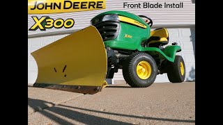 Installing a front blade kit on a John Deere X300 [upl. by Adnowal]