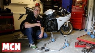 How to Use a paddock stand  Products  Motorcyclenewscom [upl. by Viccora]