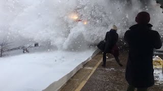 Watch Amtrak Train Create Crazy Wave of Snow While Pulling Into Station [upl. by Ninnahc]